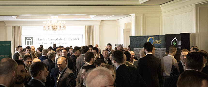 Conference attendees gather in the vendor area